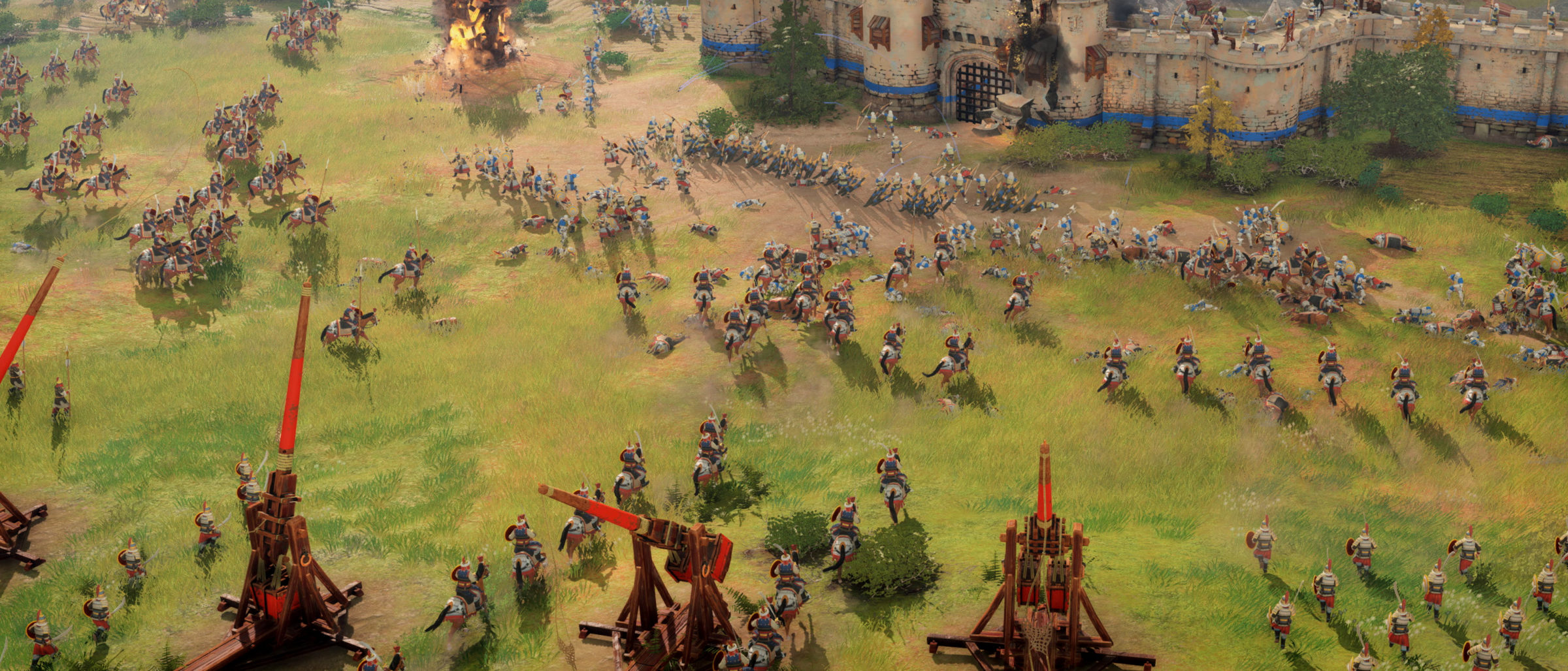 Screenshot of battle scene with trebuchets from Age of Empires game
